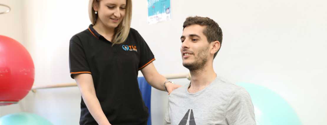 Physiotherapist Budawia Bechara provides personalized care, demonstrating her expertise while assisting a participant during a session in our clinic in Sydney, NSW.